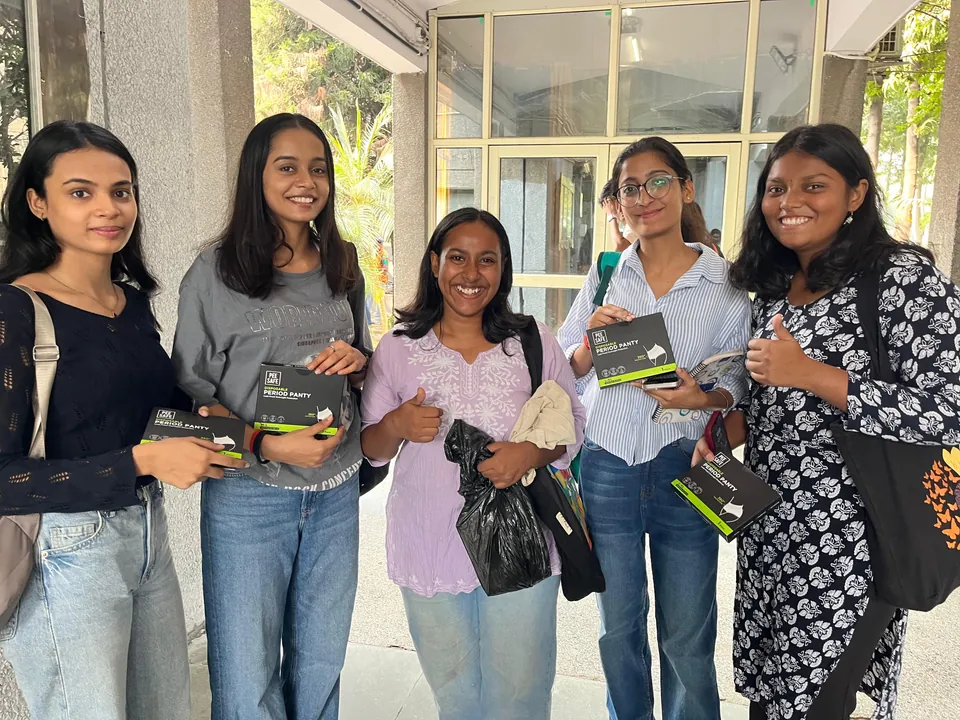 Student ambassadors handing out Pee Safe samples on campus